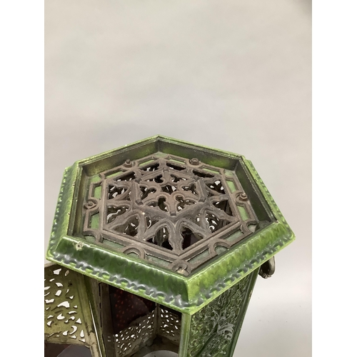20 - An early 20th century green enamelled cast iron lantern casing of hexagonal outline, pierced in flor... 