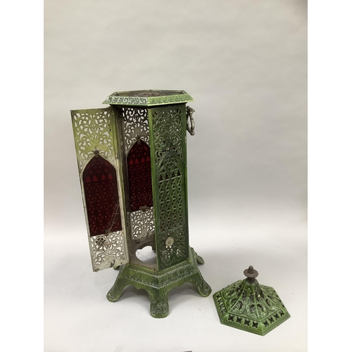 20 - An early 20th century green enamelled cast iron lantern casing of hexagonal outline, pierced in flor... 