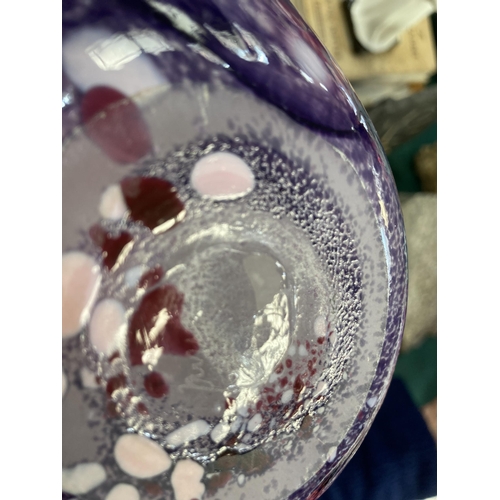 7 - A studio glass vase form the National Glass Centre of flattened ovoid form, the glass marbled in pin... 