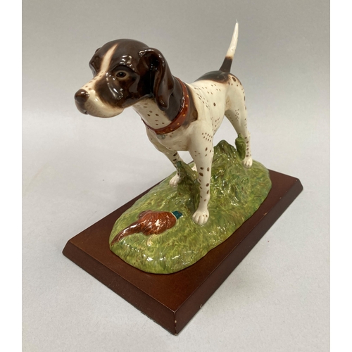 41 - A Royal Doulton pottery figure of a Pointer and pheasant, 17cm height