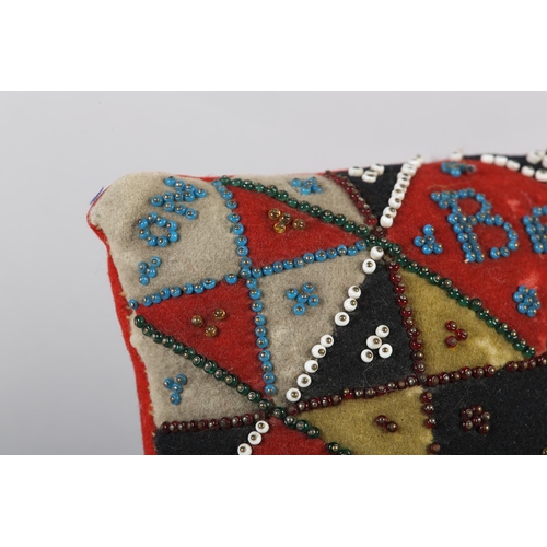 16 - A VICTORIAN BEADWORK LOVE TOKEN of square outline, yellow, white, black and red patchwork felt borde... 