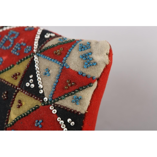 16 - A VICTORIAN BEADWORK LOVE TOKEN of square outline, yellow, white, black and red patchwork felt borde... 