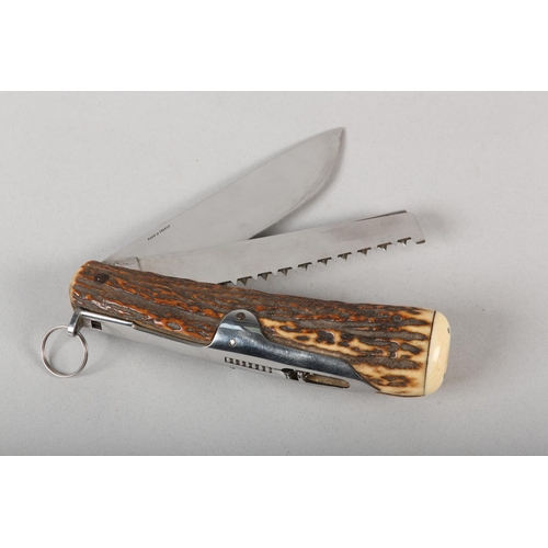 3 - AN ANTLER POCKET FOLDING TOOL KNIFE BY ELOI PERNET of France, incorporating a knife blade, a serrate... 