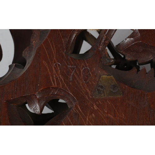 35 - A GERMAN BLACK FOREST CARVED CYCLIST'S BAROMETER, the instrument signed to the dial Vanderlyk Holost... 