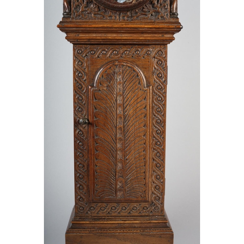 36 - A VICTORIAN MINIATURE OAK LONGCASE CLOCK CASE, having a square hood carved with tendrils flanked by ... 