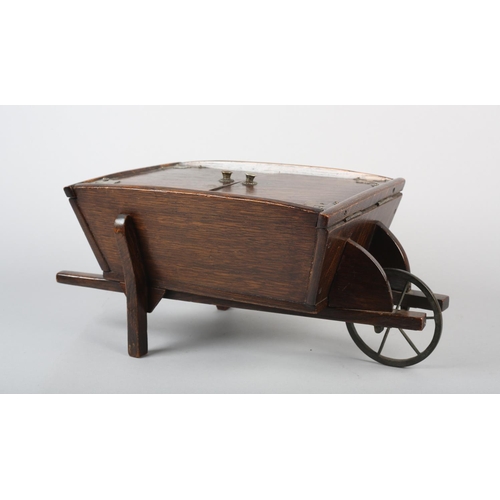 18 - AN EDWARD VII OAK WHEELBARROW WORK BOX, with iron wheel, 40.5cm long x 21cm wide x 17.5cm high