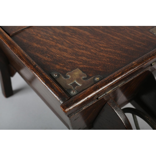 18 - AN EDWARD VII OAK WHEELBARROW WORK BOX, with iron wheel, 40.5cm long x 21cm wide x 17.5cm high