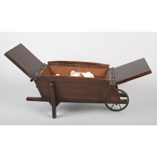 18 - AN EDWARD VII OAK WHEELBARROW WORK BOX, with iron wheel, 40.5cm long x 21cm wide x 17.5cm high