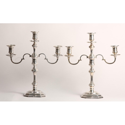 179 - A PAIR OF GEORGE V SILVER CANDELABRA, London 1937, for Thomas Bradbury & Sons Ltd, three light with ... 