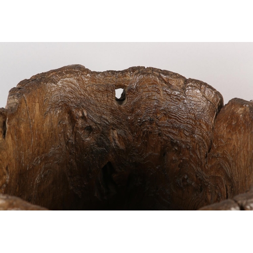 5 - A LARGE ANTIQUE HARDWOOD MORTAR, formed from a hollowed out tree trunk section, with holes to take a... 