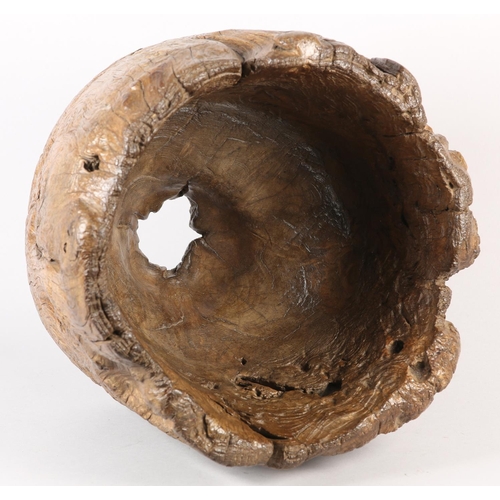 5 - A LARGE ANTIQUE HARDWOOD MORTAR, formed from a hollowed out tree trunk section, with holes to take a... 
