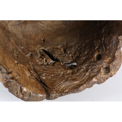 5 - A LARGE ANTIQUE HARDWOOD MORTAR, formed from a hollowed out tree trunk section, with holes to take a... 