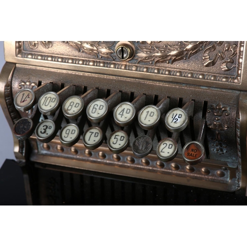 11 - AN UNUSUALLY SMALL NATIONAL CASH REGISTER CO., DAYTON OHIO USA, brass cash register cast with shield... 