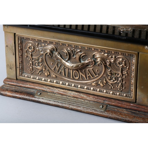 11 - AN UNUSUALLY SMALL NATIONAL CASH REGISTER CO., DAYTON OHIO USA, brass cash register cast with shield... 