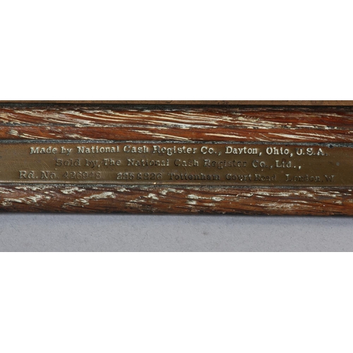 11 - AN UNUSUALLY SMALL NATIONAL CASH REGISTER CO., DAYTON OHIO USA, brass cash register cast with shield... 