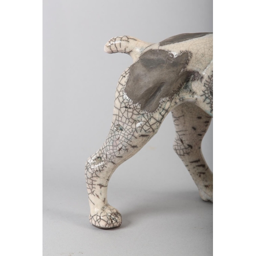 57 - KEZA RUDGE (British 1966) GUN DOG, studio pottery with raku glaze, incised signature to underside, 1... 