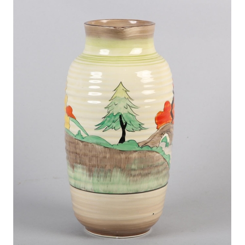 53 - A CLARICE CLIFF SINGLE HANDLED JUG OF LORNA PATTERN, c.1936, the ribbed body painted with a cottage ... 