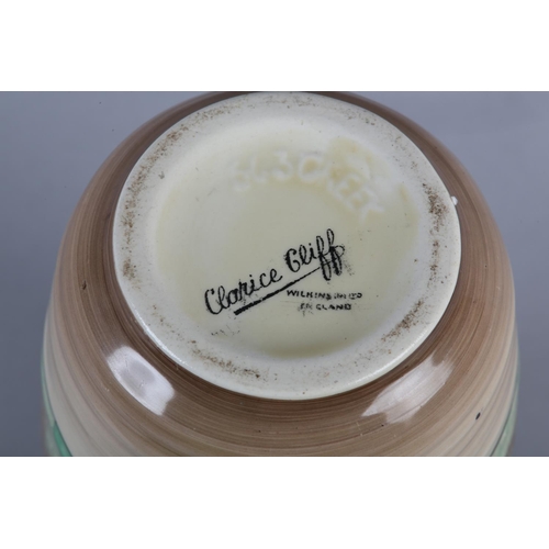 53 - A CLARICE CLIFF SINGLE HANDLED JUG OF LORNA PATTERN, c.1936, the ribbed body painted with a cottage ... 