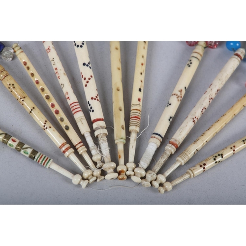 15 - A COLLECTION OF ELEVEN 19TH CENTURY BONE AND BEADED LACE BOBBINS decorated with coloured bands and n... 