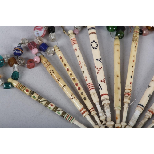 15 - A COLLECTION OF ELEVEN 19TH CENTURY BONE AND BEADED LACE BOBBINS decorated with coloured bands and n... 