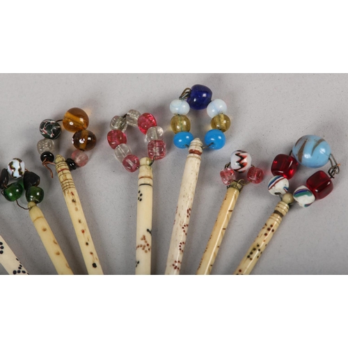 15 - A COLLECTION OF ELEVEN 19TH CENTURY BONE AND BEADED LACE BOBBINS decorated with coloured bands and n... 