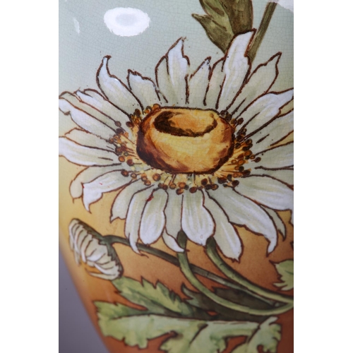 54 - A 19TH CENTURY PAIR OF DOULTON LAMBETH FAIENCE VASES of baluster form, printed and enamelled with as... 