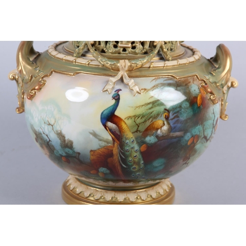 38 - A ROYAL WORCESTER PORCELAIN TWO HANDLED POT POURRI VASE AND COVER SIGNED BY A SHUCK, painted with pe... 