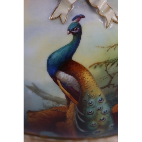 38 - A ROYAL WORCESTER PORCELAIN TWO HANDLED POT POURRI VASE AND COVER SIGNED BY A SHUCK, painted with pe... 