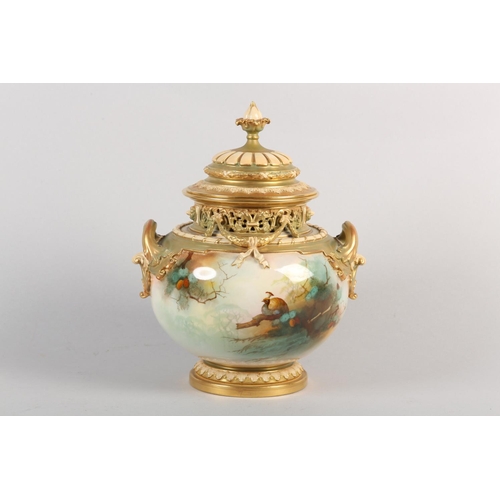 38 - A ROYAL WORCESTER PORCELAIN TWO HANDLED POT POURRI VASE AND COVER SIGNED BY A SHUCK, painted with pe... 