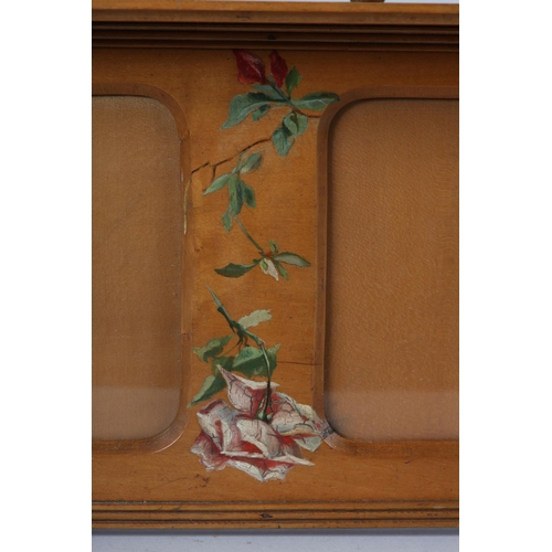 24 - A LATE 19TH CENTURY BEECH TRIPLE HANGING PHOTOGRAPH FRAME, painted, below a spindle gallery rail, 54... 