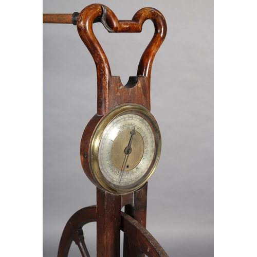 30 - A GEORGE III MAHOGANY WAYWISER, having an iron mounted spoked wheel below a stirrup-shaped handle, t... 