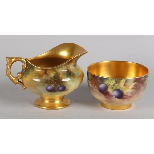 43 - A ROYAL WORCESTER FRUIT PAINTED CREAM JUG, signed by W Bee, the compressed body with apples and grap... 