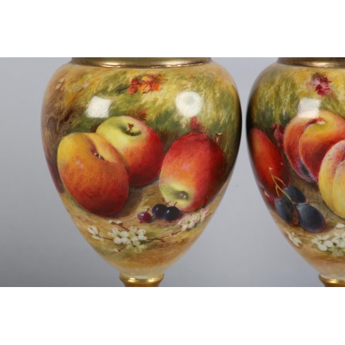 44 - A PAIR OF ROYAL WORCESTER FRUIT PAINTED VASES, signed by Ricketts, one with apples and cherries, the... 