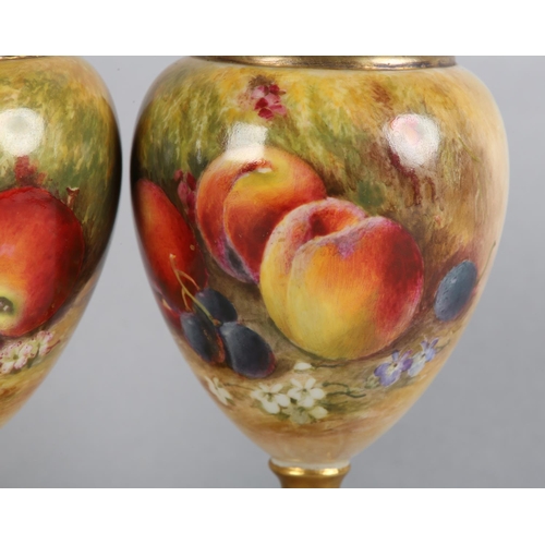 44 - A PAIR OF ROYAL WORCESTER FRUIT PAINTED VASES, signed by Ricketts, one with apples and cherries, the... 