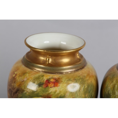 44 - A PAIR OF ROYAL WORCESTER FRUIT PAINTED VASES, signed by Ricketts, one with apples and cherries, the... 
