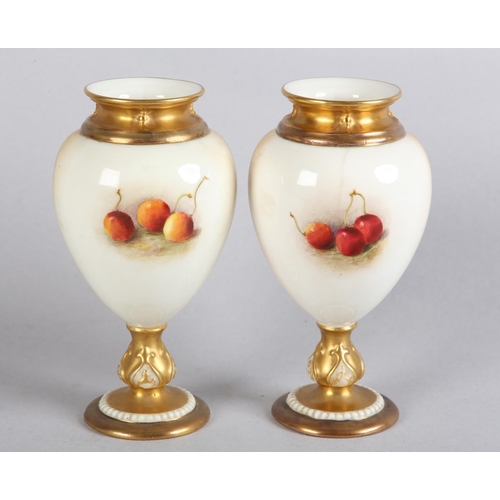 44 - A PAIR OF ROYAL WORCESTER FRUIT PAINTED VASES, signed by Ricketts, one with apples and cherries, the... 