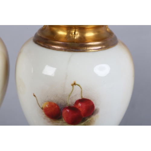 44 - A PAIR OF ROYAL WORCESTER FRUIT PAINTED VASES, signed by Ricketts, one with apples and cherries, the... 