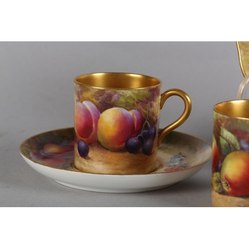 48 - A ROYAL WORCESTER COFFEE CAN AND SAUCER, A PLATE (16CM) AND A FURTHER COFFEE CAN AND ASSOCIATED SAUC... 