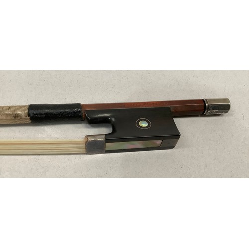 296 - AN EARLY 20TH CENTURY VIOLIN BOW BY VICTOR FETIQUE, silver mounted and inlaid with abalone, stamped ... 