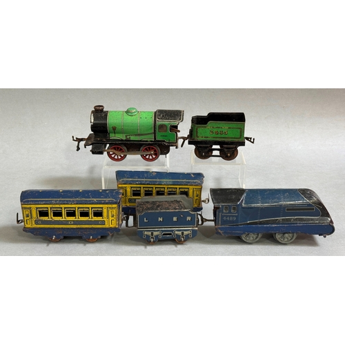 59 - A clockwork Mettoy A4 Class model of the Mallard steam locomotive and tender with two carriages, alo... 