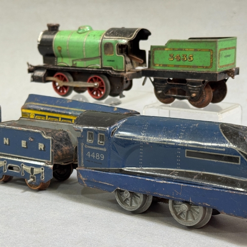 59 - A clockwork Mettoy A4 Class model of the Mallard steam locomotive and tender with two carriages, alo... 