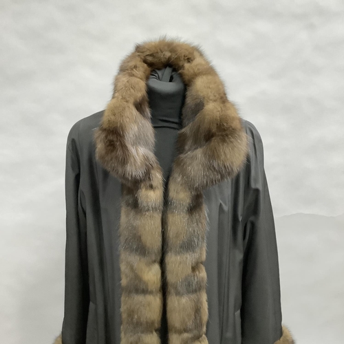 279 - A mink-lined and trimmed and black jacket with slip pockets by Hockley, Size 8 approximately