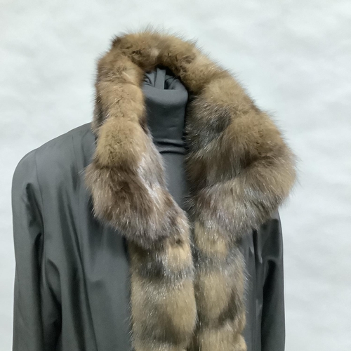 279 - A mink-lined and trimmed and black jacket with slip pockets by Hockley, Size 8 approximately