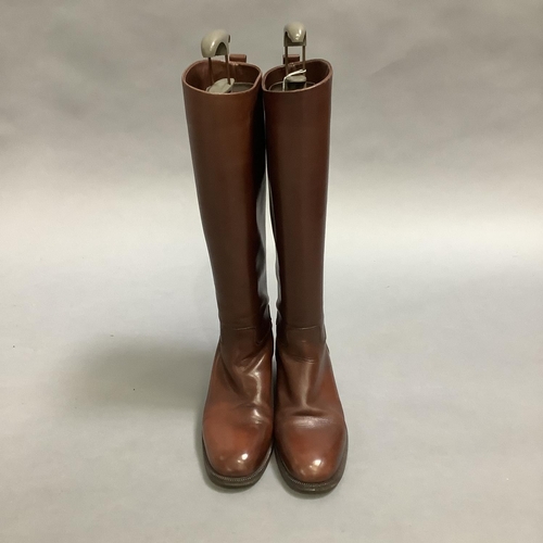 292 - A pair of Etienne Aigner lady's knee high boots in dark brown leather, size shown 7½ (USA?) some mar... 