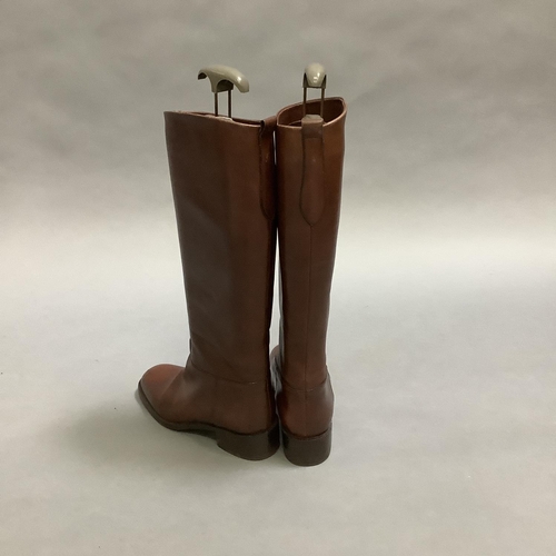 292 - A pair of Etienne Aigner lady's knee high boots in dark brown leather, size shown 7½ (USA?) some mar... 
