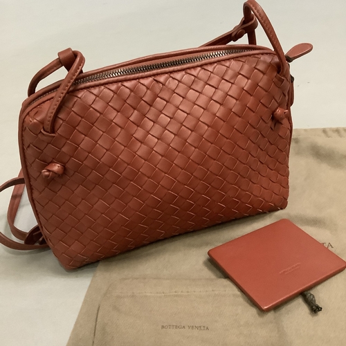 298 - A Bottega Veneta sapele intrecciato leather cross body bag, 26cm wide, with dust bag and matching mi... 