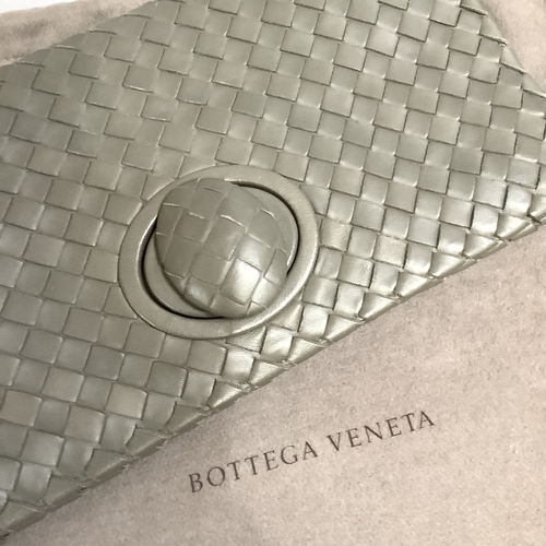 300 - A Bottega Veneta olive green/grey tone intrecciato leather clutch bag with oval button clasp, 28.5cm... 