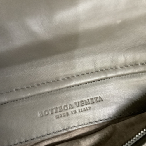 300 - A Bottega Veneta olive green/grey tone intrecciato leather clutch bag with oval button clasp, 28.5cm... 