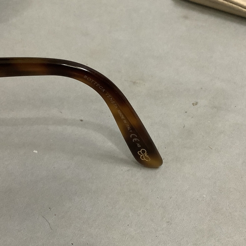 302 - A pair o  Bottega Veneta sun glasses in brown intrecciato leather case