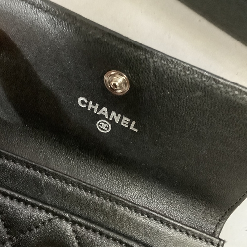 303 - A Chanel black leather card wallet in original box with authentication card No. 17364237 together wi... 